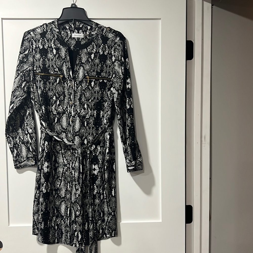 Calvin Klein fully lined belted  dress, falls a little above your knees.